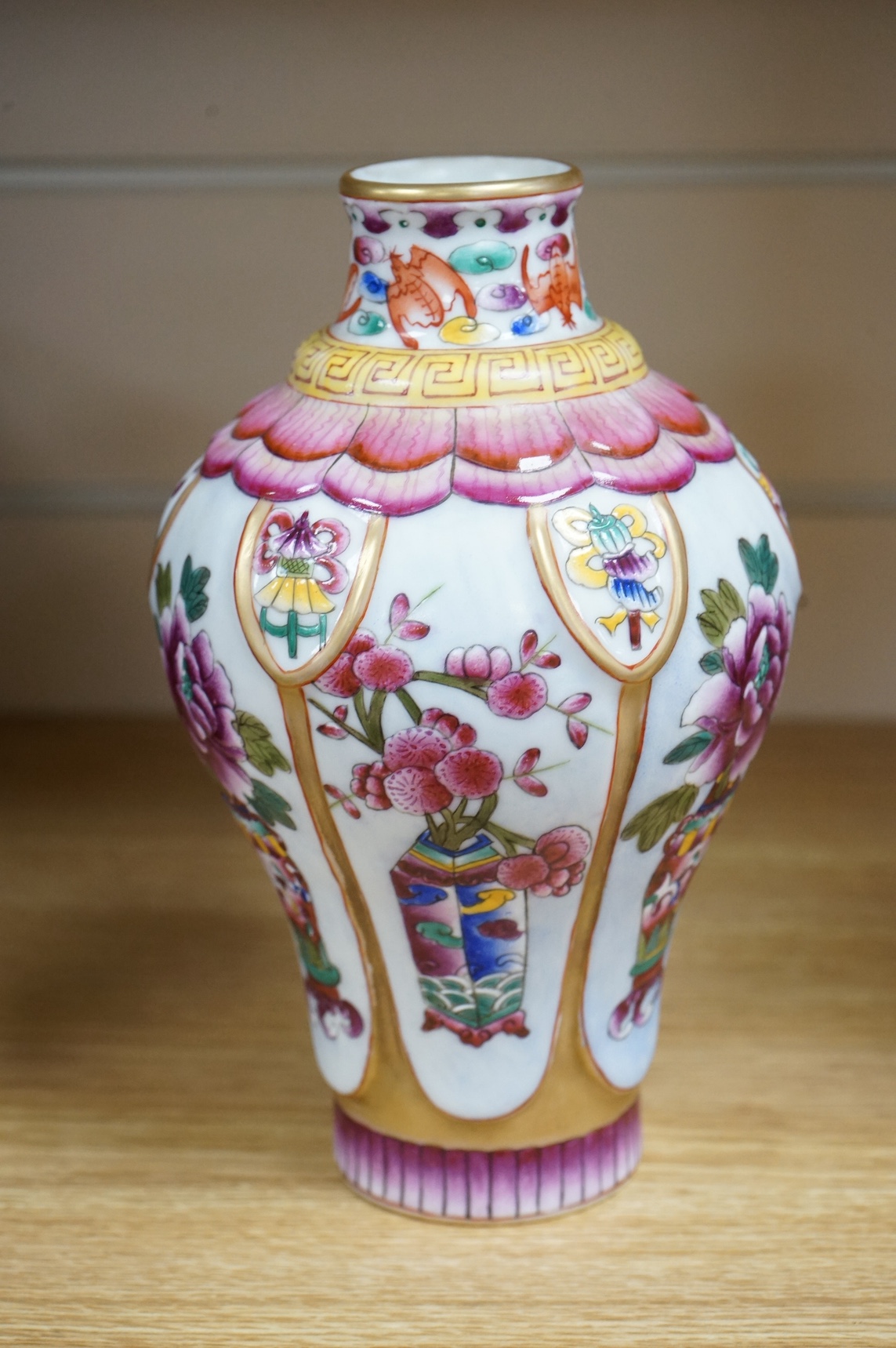 A Chinese famille rose vase enamelled with flowers, 20cm high. Condition - good